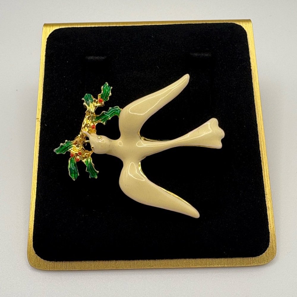 Elegant Cream Dove Brooch with Green and Gold Accents
